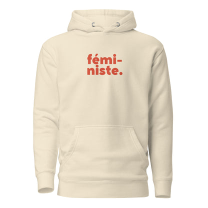 Bone hoodie, front view, with red stacked 'fémi-niste.' lettering.
