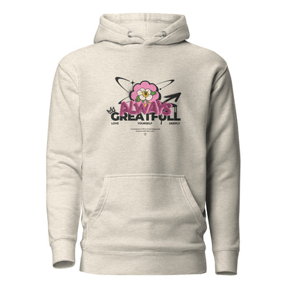 Oatmeal Heather hoodie, front view, with a smiling pink flower and 'Always Grateful' lettering.