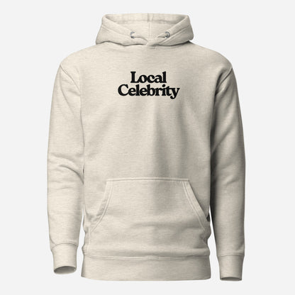Oatmeal Heather hoodie, front view with black Local Celebrity lettering.