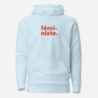 Sky Blue hoodie, front view, with red stacked 'fémi-niste.' lettering.