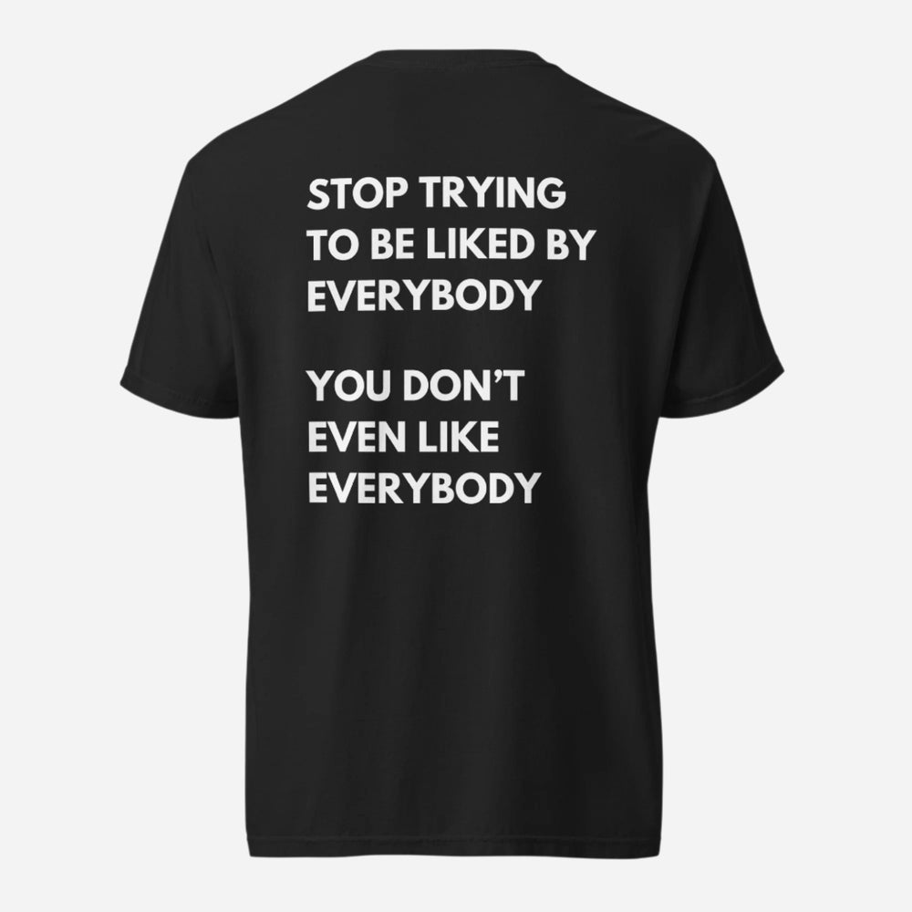 Black T-shirt, back view, with stacked white 'Stop Trying To Be Liked By Everybody' slogan text.