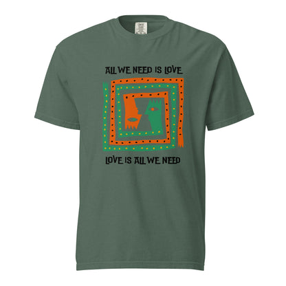 Blue Spruce T-shirt, front view, with orange and green abstract faces framed by 'All We Need Is Love' text.