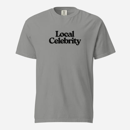 Grey T-shirt, front view, with black stacked 'Local Celebrity' lettering.