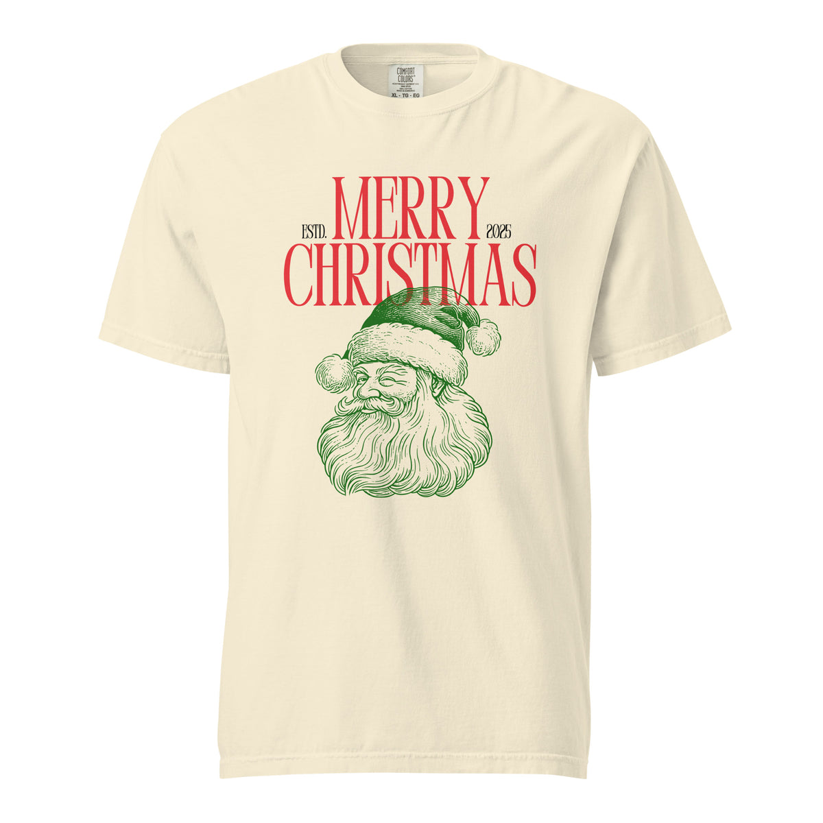 Ivory T-shirt, front view with a green Santa face and red "Merry Christmas" lettering.