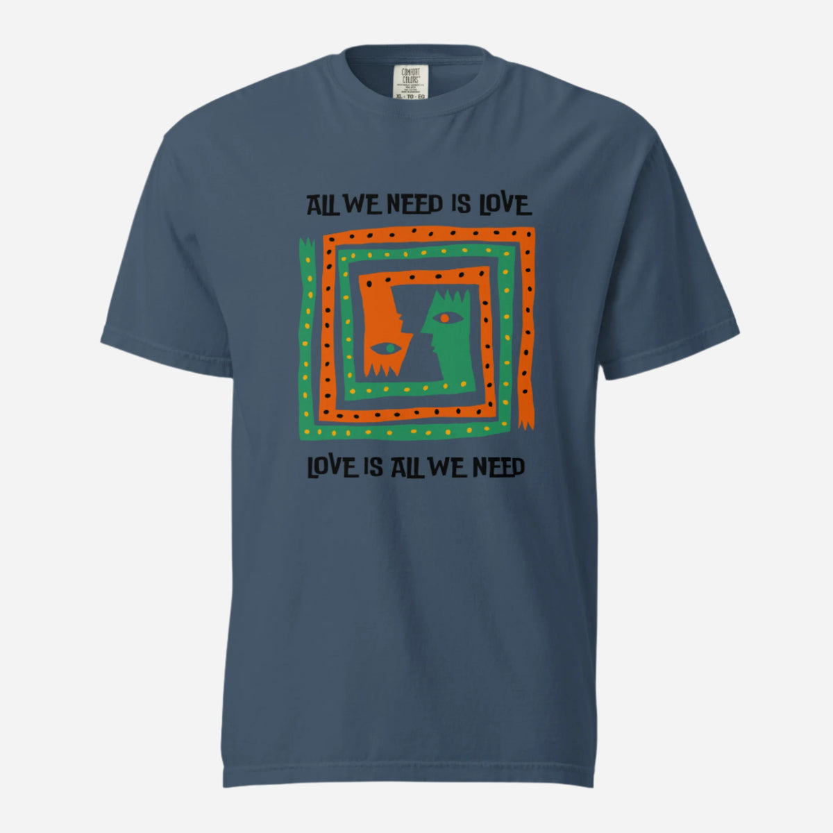 Midnight T-shirt, front view, with orange and green abstract faces framed by 'All We Need Is Love' text.