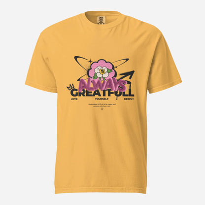 Mustard T-shirt with a pink flower and Always Grateful lettering, front view.