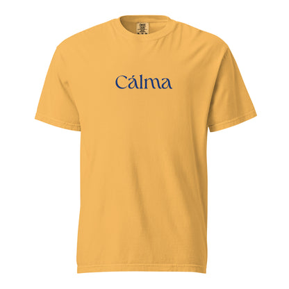 Mustard T-shirt, front view, with blue 'Calma' lettering.