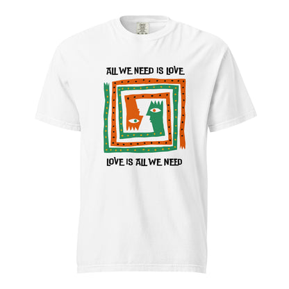 White T-shirt, front view, with orange and green abstract faces framed by 'All We Need Is Love' text.