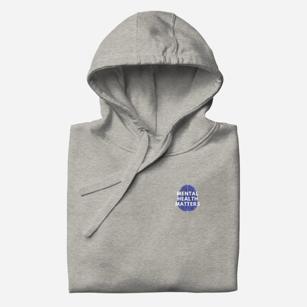 Carbon Grey hoodie with a small Mental Health Matters chest badge, folded view.