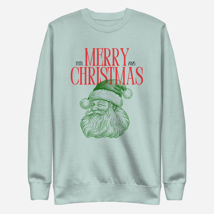 Agave sweatshirt, front view, with a green Santa portrait below red 'Merry Christmas' lettering and the year 2025.