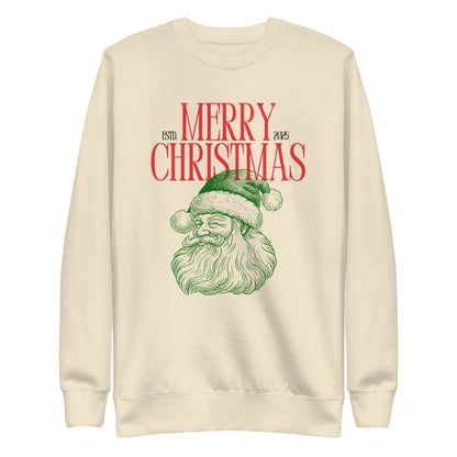 Bone sweatshirt, front view, with a green Santa portrait below red 'Merry Christmas' lettering and the year 2025.