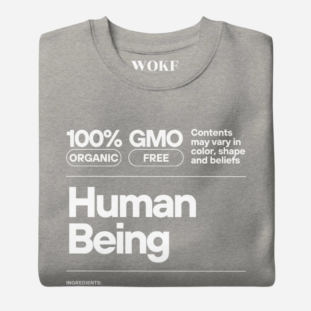 Folded Carbon Grey sweatshirt, showing a white "Human Being" label-style graphic.