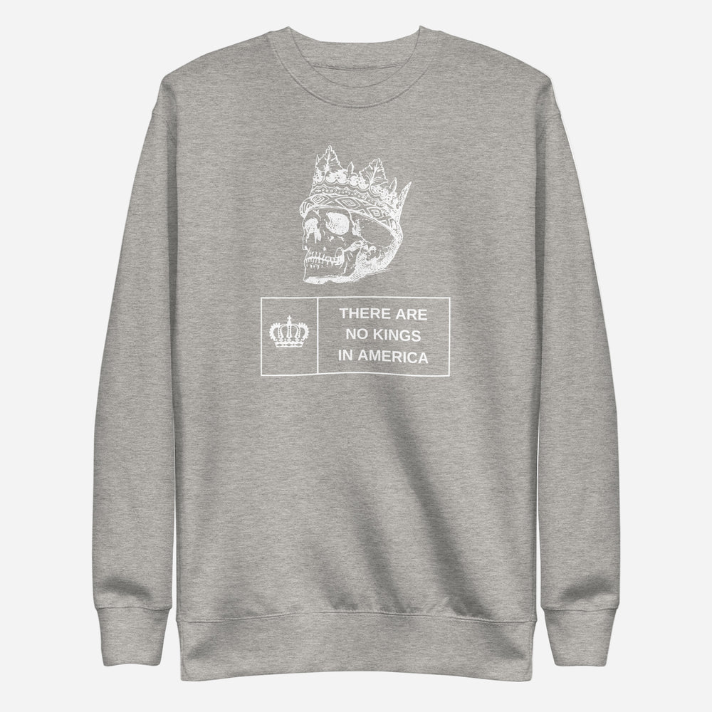 Carbon Grey sweatshirt, front view with a white crowned skull and "There Are No Kings in America" lettering.