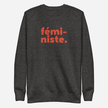 Charcoal Heather sweatshirt with red fémi-niste lettering, front view.