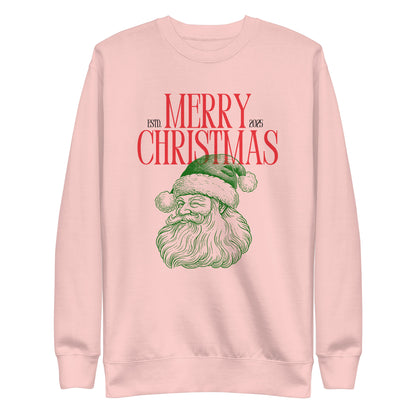Light Pink sweatshirt, front view, with a green Santa portrait below red 'Merry Christmas' lettering and the year 2025.